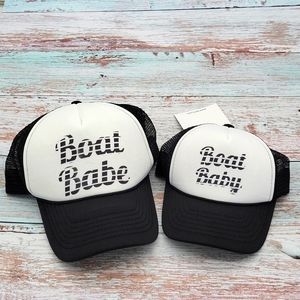 Matching trucker hats, adult and baby